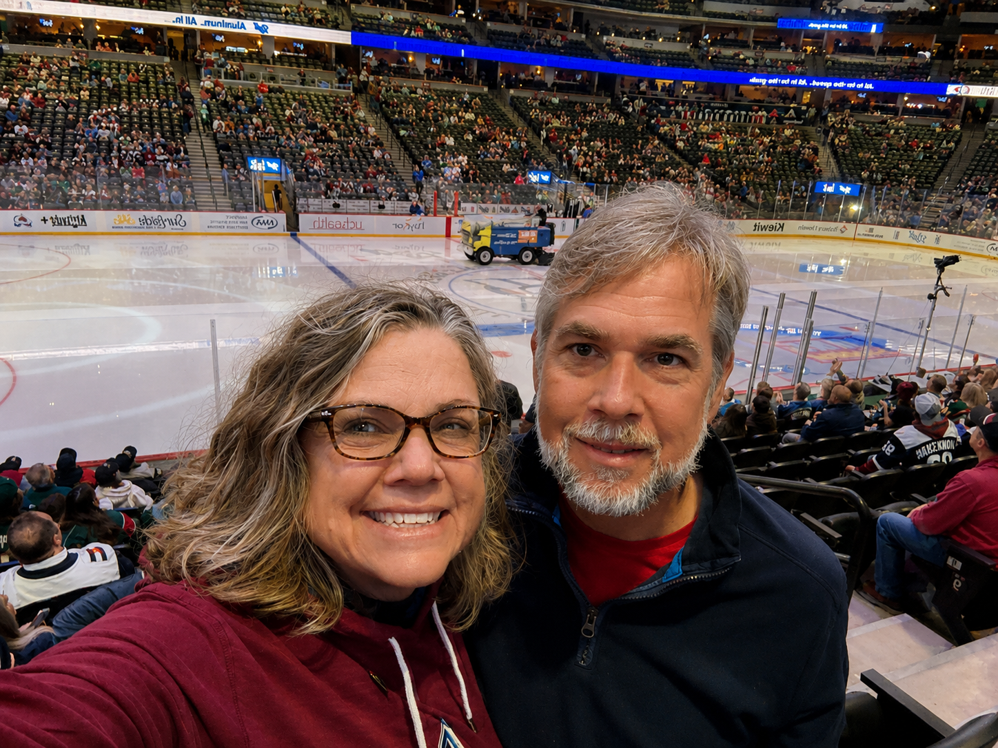 Carole and Nathan in front of Ball Arena rink