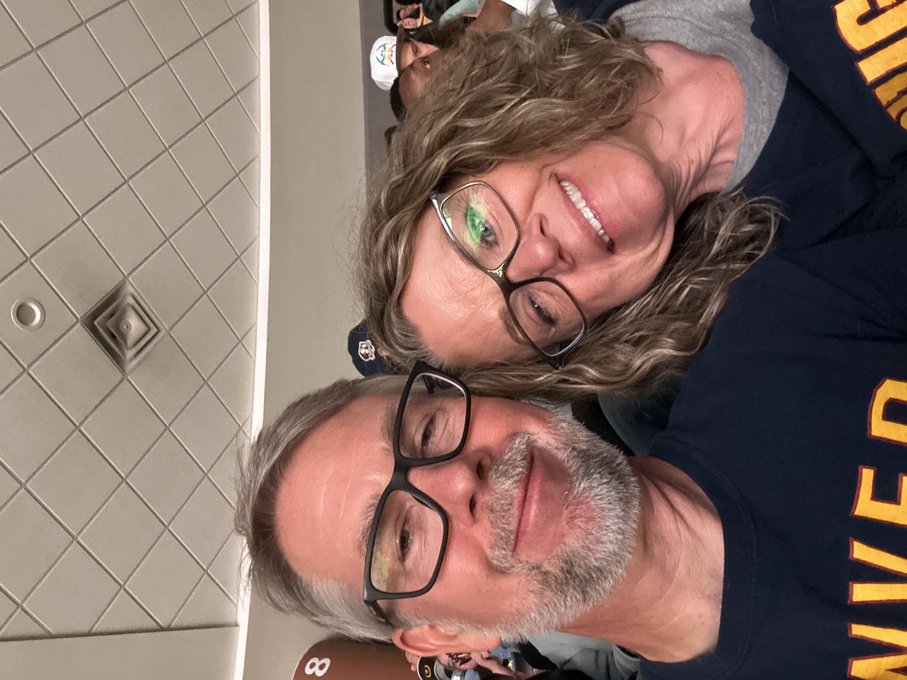 Carole and Nathan at a nuggets game