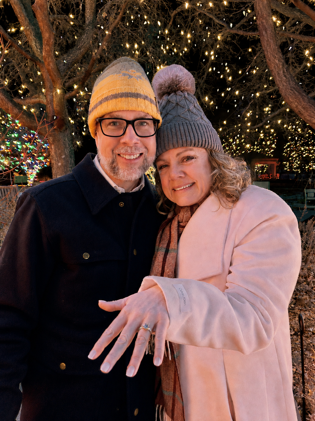 Carole and Nathan at the botanic gardens with a glistening ring.
